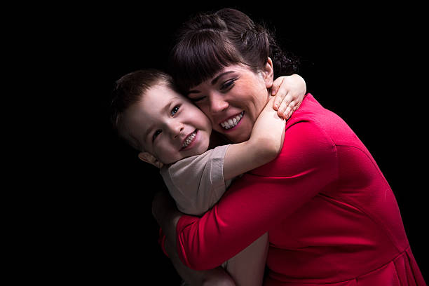 istock Happy hugging mother and son 516958568