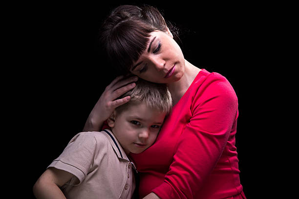 istock Gentle hugging mother and little son 516959136