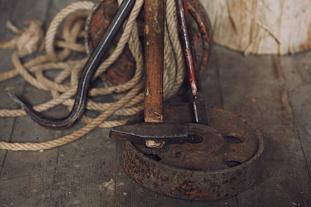 istock hammer and nail puller lays on wooden floor 516959172