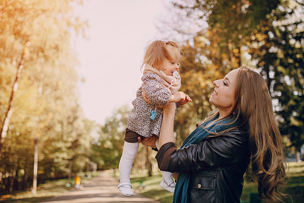 istock young family walking in the park 516959414
