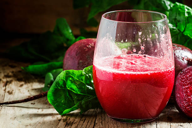 istock Beetroot smoothie in a large glass, fresh beets with tops 516959962