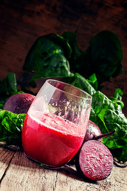 istock Beetroot smoothie in a large glass, fresh beets with tops 516960056