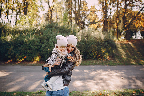 istock young family walking in the park 516960144