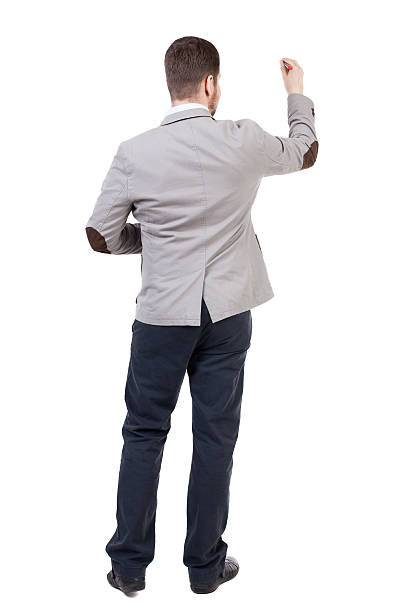 istock back view of writing business man in suit. 516960210
