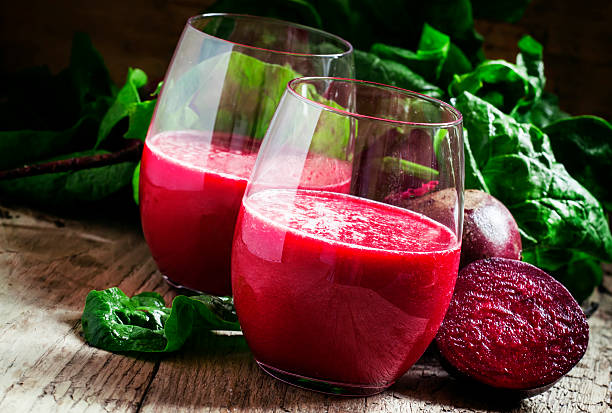 istock Beetroot smoothie in a large glass, fresh beets with tops 516960272