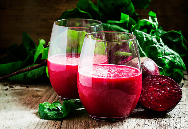 istock Beetroot smoothie in a large glass, fresh beets with tops 516960376