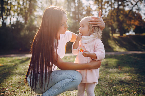 istock young family walking in the park 516961084