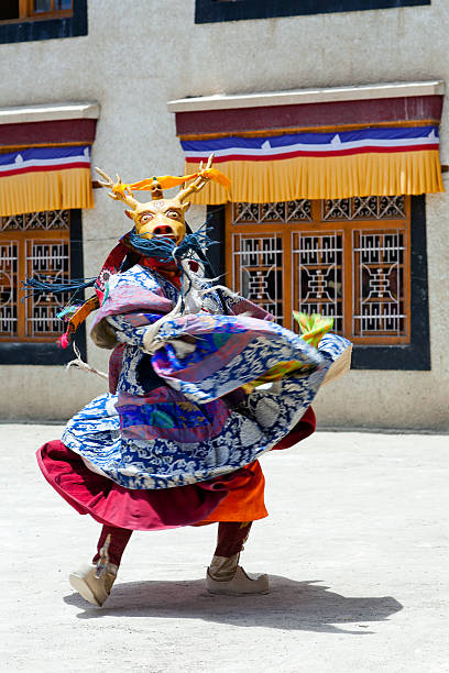 Cham Dance in Lamayuru Gompa in Ladakh, North India Lamayuru, India - June 17, 2012: Buddhist monk in Deer mask dancing Cham mystery during Yuru Kabgyat festival at Lamayuru Gompa in Ladakh, Jammu and Kashmir, North India cham mask stock pictures, royalty-free photos & images
