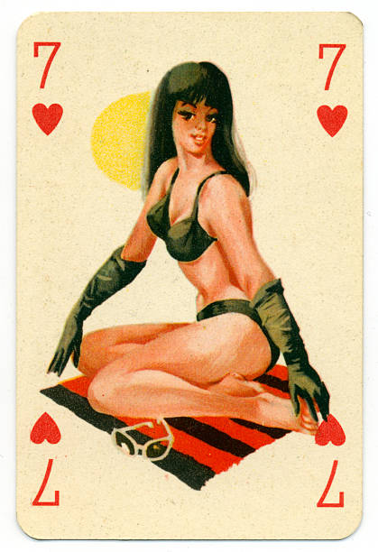 Seaside pin-up Romikartya 4 vintage playing card Hungary 1950s This Seven of Hearts pin-up playing card was manufactured in the 1950s by Játékkártyagyár és Nyomda (the National Playing Card Factory and Printing Company) of Budapest in Hungary. It shows a bathing beauty / pin-up from the pack known as Romikartya 4, which features 1950s pin-up girls, bathing beauties with seaside backgrounds. This model is wearing a black bikini, sitting on a towel, sunbathing with the sun behind her. The company traded from 1950-1974. Following the Second World War, from 1946-1949, the Austrian-owned company Piatnik continued to operate the factory under licence. In 1950 it became the National Playing Card Factory and Printing Company, incorporating several firms such as the factory in Rottenbiller street; Albert Bakács & Son Printing House, and Emil Seidner posters and label printing press. pin up girl photos stock pictures, royalty-free photos & images