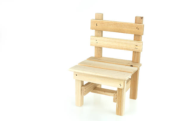 istock Wooden toy chair isolated on white background 516962540