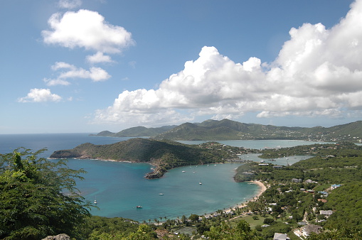 Antigua and Barbuda is a twin-island country in the Americas, lying between the Caribbean Sea and the Atlantic Ocean. It consists of two major inhabited islands, Antigua and Barbuda, and a number of smaller islands (including Great Bird, Green, Guinea, Long, Maiden and York Islands and further south, the island of Redonda). The permanent population numbers about 81,800 (at the 2011 Census) and the capital and largest port and city is St. John's, on Antigua.