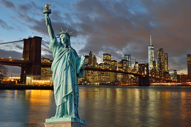 istock Brooklyn Bridge at night and Statue of Liberty. 516976786