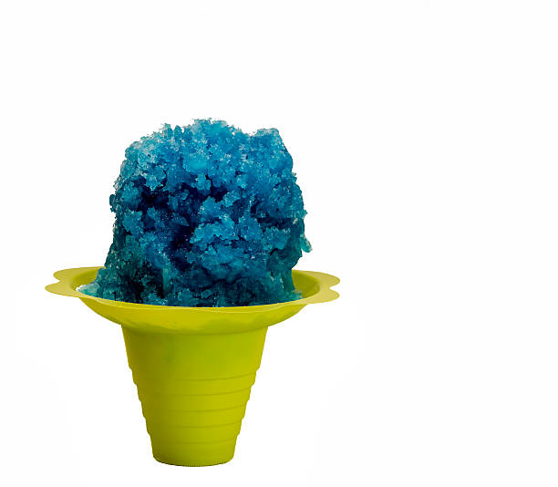 istock Blue Hawaiian shaved ice, snow cone in a Flower Cup. 516977704