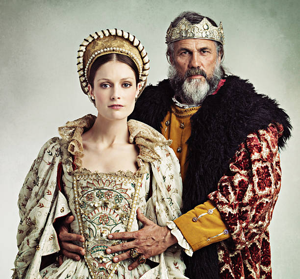Safeguarding the future king Studio portrait of a stern-looking king and queen queen royal person stock pictures, royalty-free photos & images