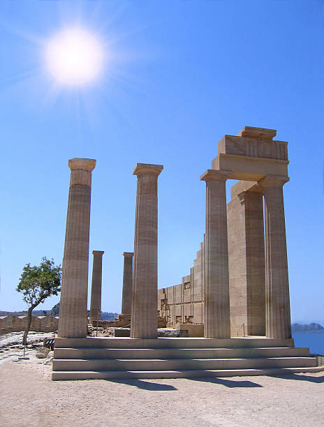 Ruins of ancient Greek temple Ruins of ancient Greek temple with columns in summer day. Lindos, Rhodes olympeion stock pictures, royalty-free photos & images