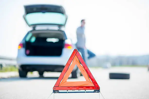 Photo of Car problems, red warning triangle!