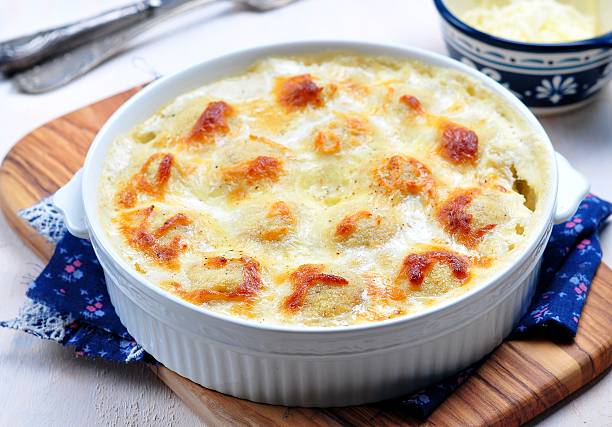 istock fish balls baked in a creamy sauce with mozzarella 516980608