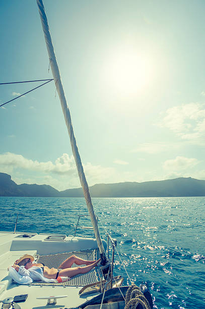 istock Woman relaxing on a sailboat. 516981366