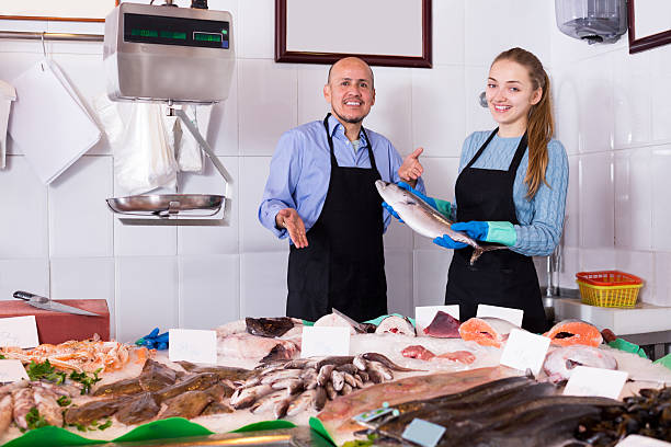 istock girl and man posing near display 516981464