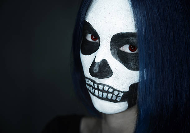 istock Woman with skull face art 516981563