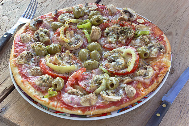 istock Delicious italian pizza on wooden table 516981733
