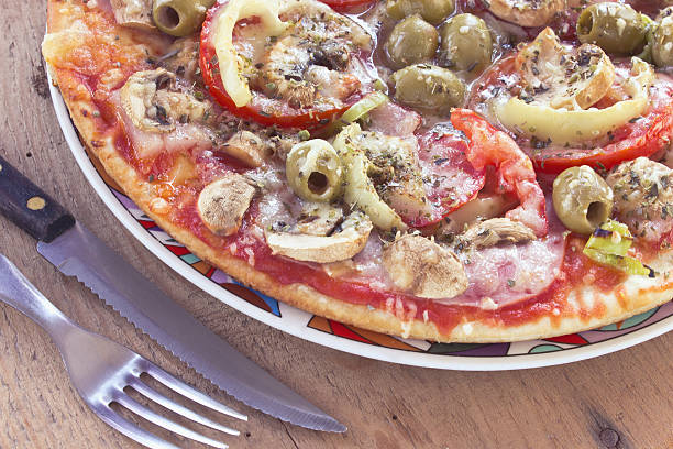istock Delicious italian pizzas served on wooden table 516981735