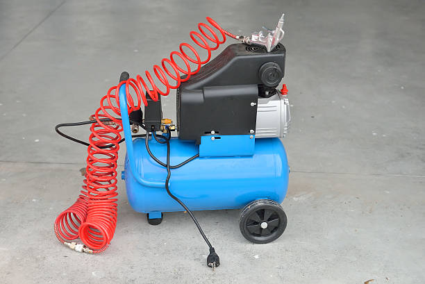 istock Blue pump compressor for washing cars, indoor. Cleaning concept. 516981774