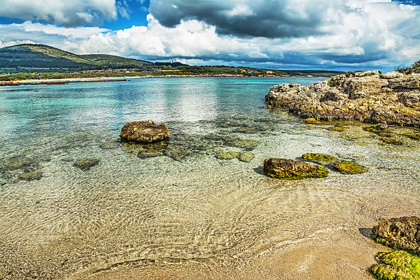 istock rocks in the water in Alghero 516981980