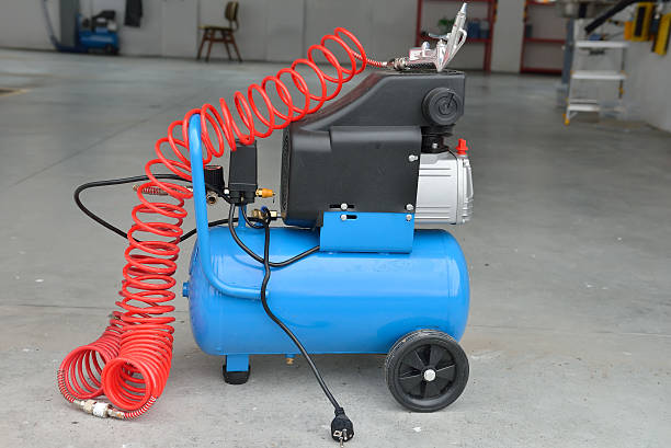istock Blue pump compressor for washing cars, indoor. Cleaning concept. 516982066