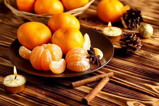 istock Ripe mandarins on a brown wooden table 516982232
