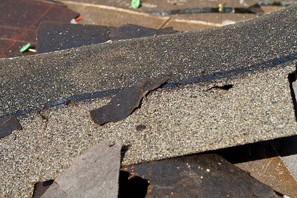 istock Damaged Roof Shingles Trash Pile 516982311