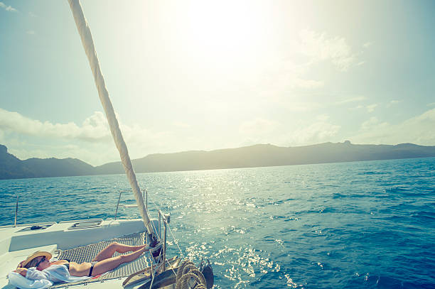 istock Woman relaxing on a sailboat. 516982700