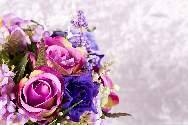 istock artificial flower bouquet on blurred light grey velvet background 516982770