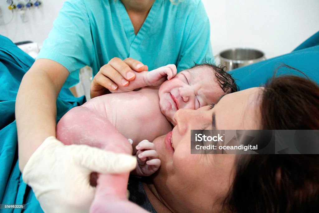 Newborn and Mother in hospital Childbirth Stock Photo