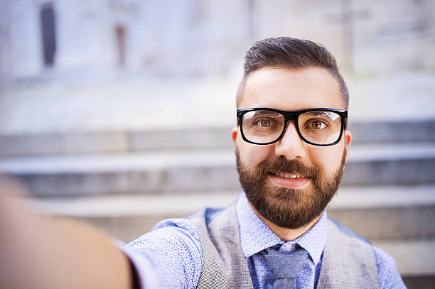 istock Hipster businessman taking selfie 516983447