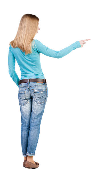 istock Back view of  pointing woman. 516983866
