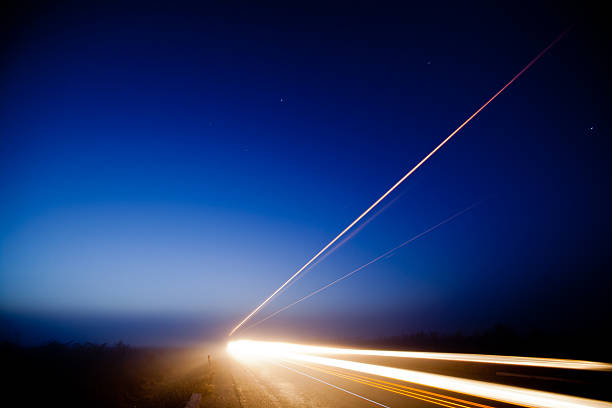 istock Blue sunrise whit light trail from cars 516984464