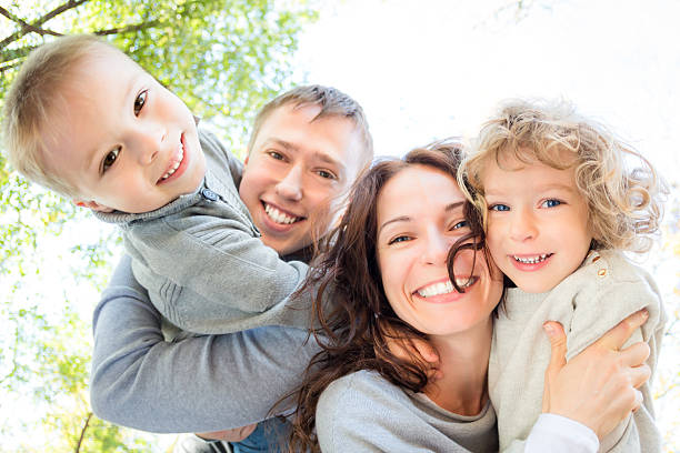 istock Low angle view of happy family 516984511
