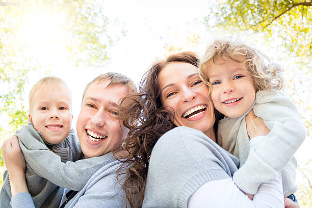 istock Happy family in autumn park 516984517