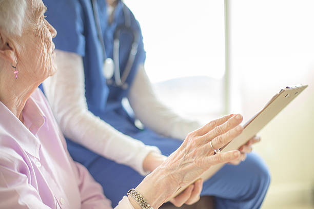 istock Elderly woman getting care in a home like setting 516985182