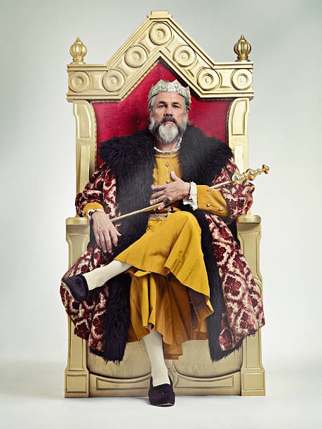 I took the throne peacefully...True Story.. Studio shot of a richly garbed king sitting on a throne king royal person stock pictures, royalty-free photos & images