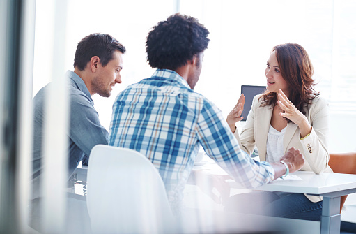 Shot of three young colleagues having a meeting in the boardroomhttp://195.154.178.81/DATA/i_collage/pu/shoots/784409.jpg