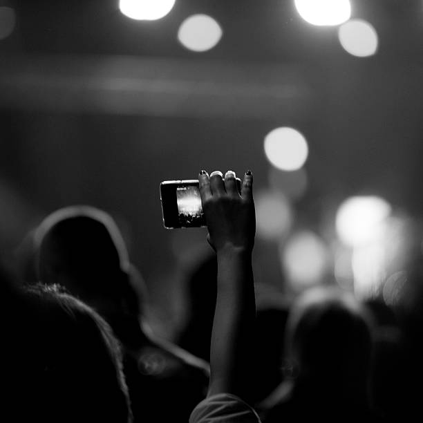 istock Group of people enjoying a concert 516986277