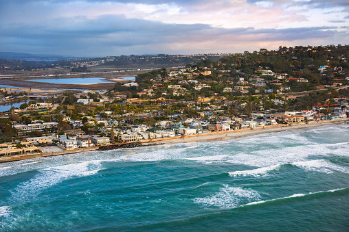 An aerial view of the coastline of Del Mar, California, located about 20 miles north of downtown San Diego.  I shot this image from an altitude of about 300 feet during a chartered helicopter photo flight just as storm clouds cleared.  