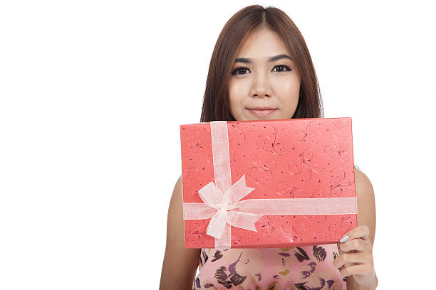 istock Beautiful Asian woman show red gift box 516986973