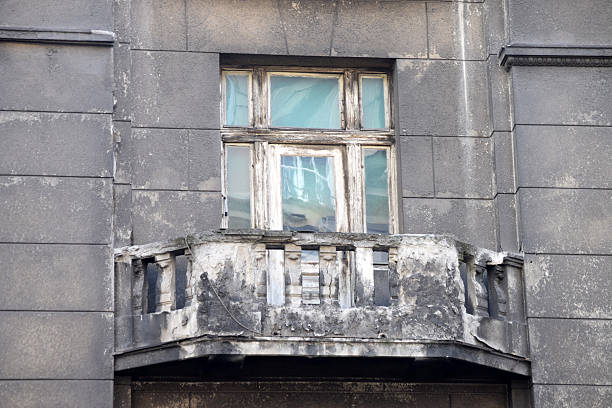 Ruined antique balcony on the old, ruined building