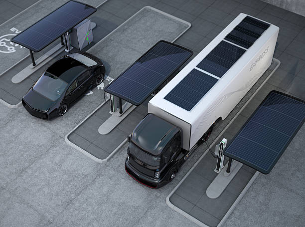 Hybrid electric truck and white electric car in charging station Hybrid electric truck and white electric car in charging station. There are solar panel units on the top of truck container. 3D rendering image. runaway vehicle stock pictures, royalty-free photos & images