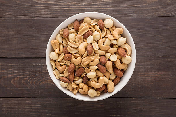 istock Almond, macadamia, peanut, cashew are in a blow 517007564