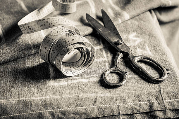 Closeup of sewing table with scissors and cloth