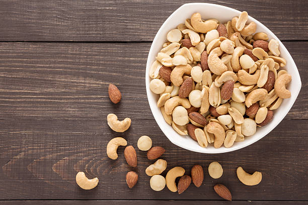 istock Almond, macadamia, peanut, cashew are in a blow 517008552